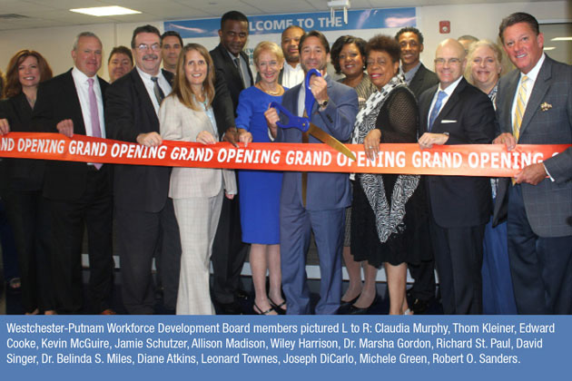 image of a group photo holding a ribbon to cut